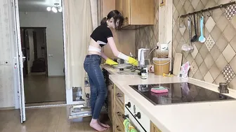 Washing dishes in yellow rubber gloves #3