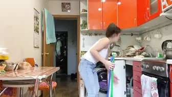 Cleaning routine kitchen and hallway in blue jeans and white top #4