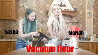 Vacuuming flour from each other while cleaning