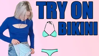 Beach fashion: Trying on a variety of swimsuits